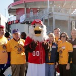 Fairfax Lions posing with "Screech"