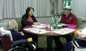 Lion Lucia calls bingo on March 18, 2015, using a braile bingo kit.