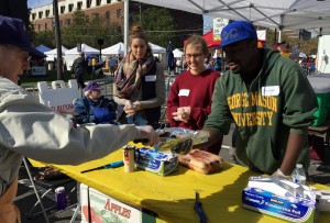 GMU students (Alpha Phi Omega service fraternity) help Lions sell food